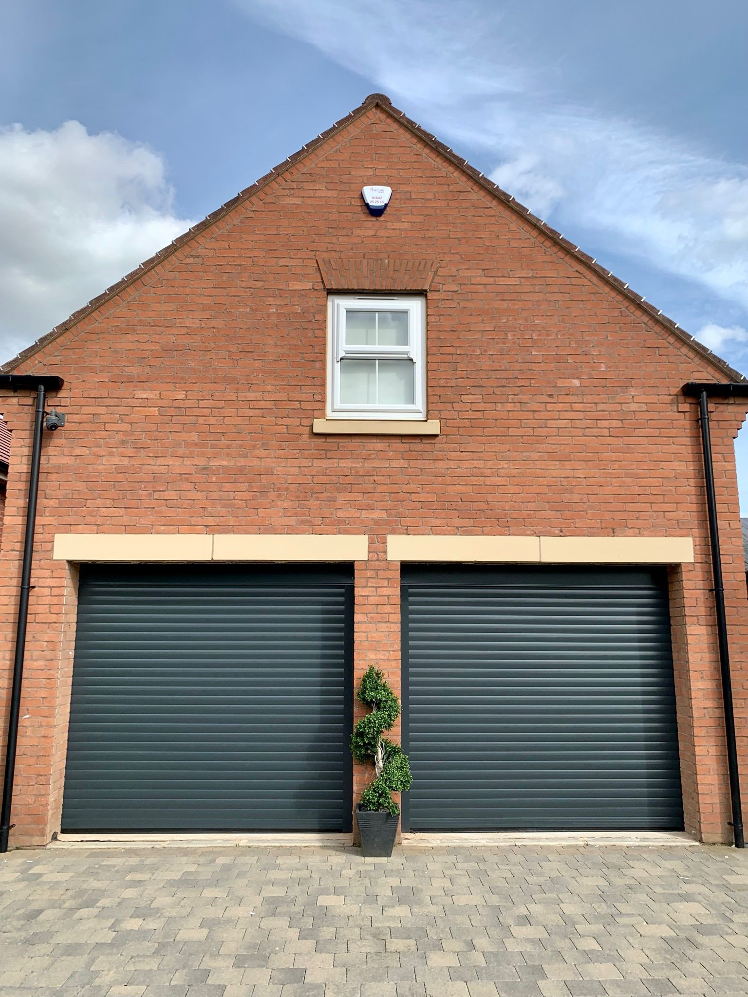 Professional roller garage door installation on a modern residential property